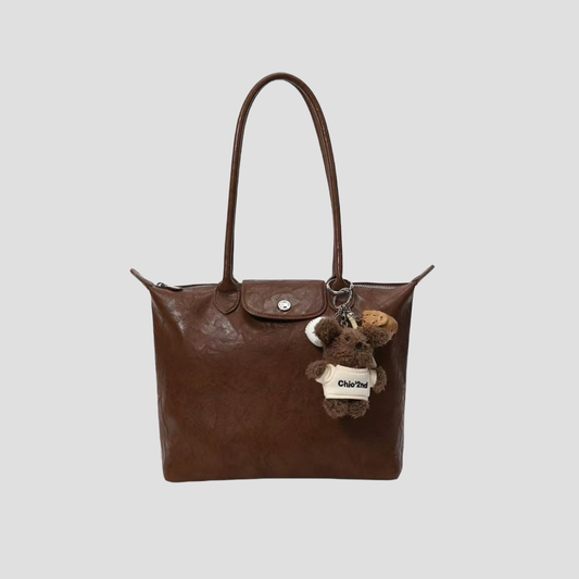 Túi Xách Nữ Da Nắp Gập Cúc Bấm Phối Charm Gấu